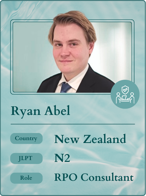A trading card style graphic featuring Ryan Abel, an RPO Consultant from New Zealand with JLPT N2 certification. The card's color scheme is light blue and white, with an icon symbolizing office work efficiency. This image aligns with an expat career guide, offering advice on finding dream jobs in Japan through Daijob for individuals from New Zealand and overseas. It particularly emphasizes consultant roles, catering to those seeking opportunities in Japan, even beyond software engineering, focusing on work in Japan and jobs for foreigners.